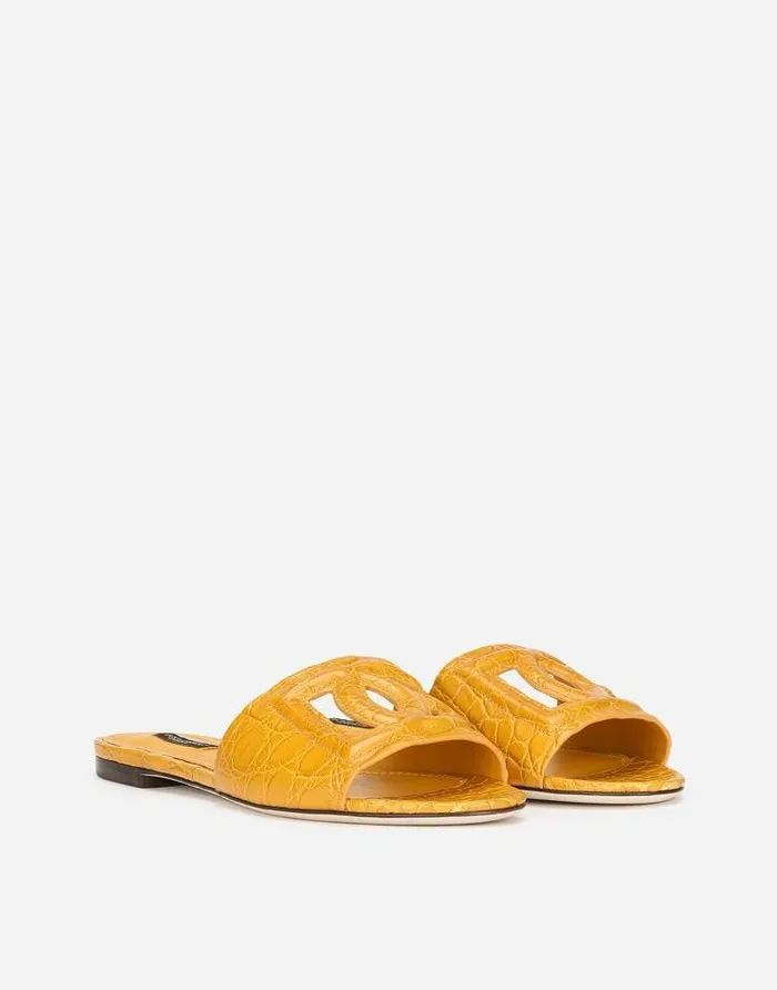 Dolce and Gabbana Slides And Mules Women Fianchi Cocco Crocodile Skin Slides With The DG Millenials Logo Orange Dolce and Gabbana Slides And Mules Women Fianchi Cocco Crocodile Skin Slides With The DG Millenials Logo Orange