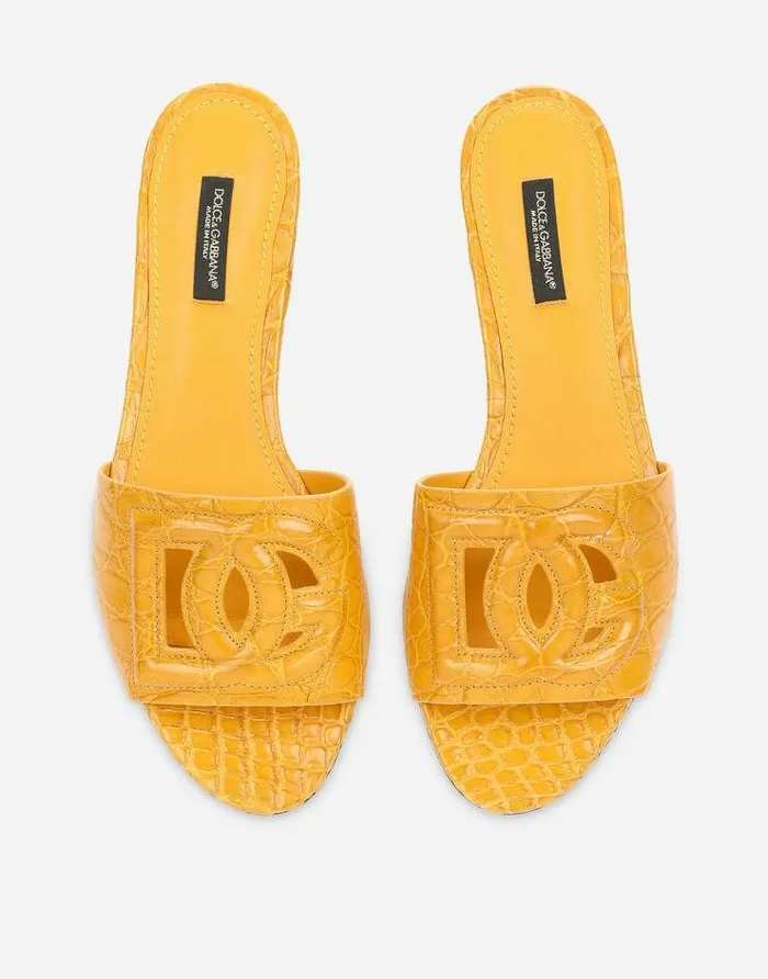 Dolce and Gabbana Slides And Mules Women Fianchi Cocco Crocodile Skin Slides With The DG Millenials Logo Orange Dolce and Gabbana Slides And Mules Women Fianchi Cocco Crocodile Skin Slides With The DG Millenials Logo Orange