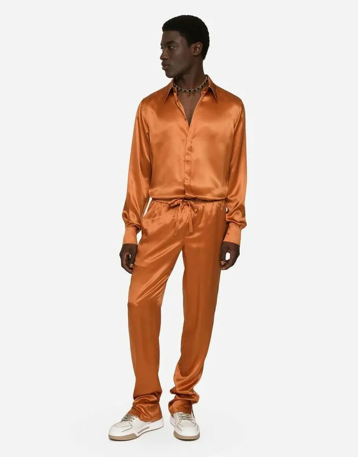 Dolce and Gabbana Trousers And Shorts Men Silk Satin Jogging Pants With Metal DG Logo Beige Dolce and Gabbana Trousers And Shorts Men Silk Satin Jogging Pants With Metal DG Logo Beige