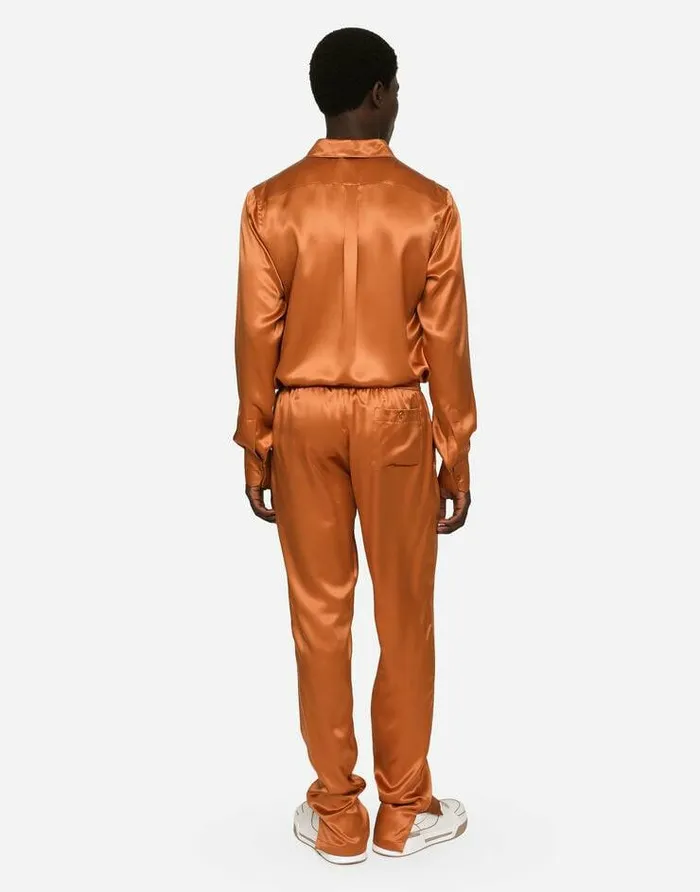 Dolce and Gabbana Trousers And Shorts Men Silk Satin Jogging Pants With Metal DG Logo Beige Dolce and Gabbana Trousers And Shorts Men Silk Satin Jogging Pants With Metal DG Logo Beige